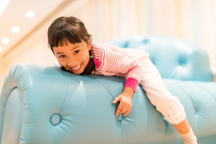 Child playing safely on indoor inflatable equipment by Bizi Bouncers UK, illustrating Safety Tips for Using a Bouncy Castle Indoors (Winter Edition)
