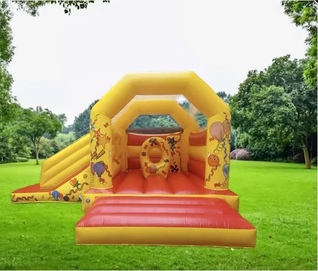 Medium jungle-themed bounce and slide bouncy castle with cheerful front slide and animal graphics