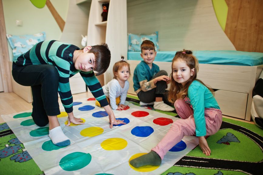 Children enjoying indoor party games as part of Winter Birthday Party Ideas That Kids Will Love (Without Going Outdoors!) by Bizi Bouncers UK
